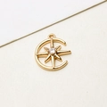 Macro view of gold crescent moon and star pendant with sparkling zircon for DIY jewelry - Crescent & Eight-pointed Star