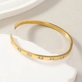 Brazalete minimalista de acero inoxidable dorado con piedra de circón rectangular vertical - Dorado