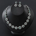 Elegant silver necklace and earrings set with emerald green round stones for weddings - Peacock Green
