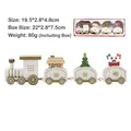 White and gold painted wooden Christmas train ornament with festive decorative figurines - White