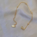 Elegant gold-plated stainless steel snake chain necklace with beads on white silk - Solid Bead Bracelet / Gold