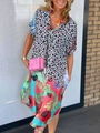 Detail of V-neck summer dress featuring leopard print and colorful tropical patterns - S / Tops / Blue
