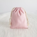 Pink cotton drawstring jewelry pouch on white faux fur background for storage - 7*9cm / Pink