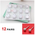 Macro detail of 12 pairs of sterilized silver-colored surgical steel ear piercing studs - Silver Smooth Round (12 Pairs)