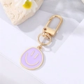 Creative purple enamel smiley face keychain with elegant gold D-ring buckle - Purple