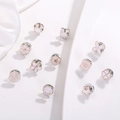 Set of 10 white enamel and gold pins featuring rabbit, flower, and star motifs - White Cartoon Style