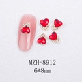 Macro detail of red heart-shaped nail gems with gold base and size marking 6x8mm - Gold Heart Style With Red Crystal (8912)