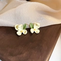 Detailed macro view of white floral stud earrings with yellow pistils and green leaves - Little Daisy (61# Silver Earring Post)