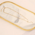Detail view of a gold double-layer butterfly necklace with pearls on marble tray - Pearl Butterfly Pendant Double Layer Style (7#)