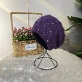 Winter purple knit beanie with pearl accents and plush texture on a display stand - Purple