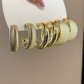 Close-up of three pairs of golden C-shape hoop earrings with various textured finishes - 26# Steel Pin (6-Piece Set) / Gold