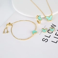 Elegantes goldenes Schmetterling-Schmuckset mit minzgrünem Emaille und Zirkonia-Akzenten - Grünes Schmetterlingsset