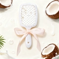 White vented hair brush with pink bow detail and coconut milk splash background - Coconut Scent (White)