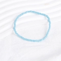 Detailed close-up of sky blue seed bead bracelet on a white textured background - Light Blue