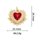 Macro shot of 18k gold plated heart wing pendant with red enamel and white zircon stones - Sun Ray Radiant Heart (DZ-016)
