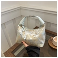 Light blue satin handbag with traditional golden embroidery and beaded tassel - Blue