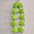 Green silicone star charm keychain with silver metal ring on textured white background - Fluorescent Green (10 Stars)