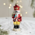 Christmas nutcracker glass ornament with red uniform and gold glitter details, 13cm tall - Soldier