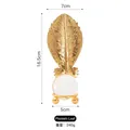 Décoration feuille de bananier dorée en métal avec boule de cristal, hauteur 16,5 cm - Feuille de bananier - Boule de cristal