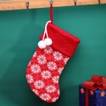 Knitted red Christmas stocking with snowflake patterns and white pom-pom decorations - Snowflake Sock