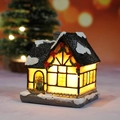LED lighted Christmas village miniature house with snow-covered roof and warm glow - Style D