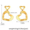 Detailed view of 18k gold plated stainless steel double heart earrings with hammered texture - Gold Double Heart (F383)