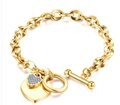 Golden titanium steel link bracelet featuring a diamond heart pendant and OT toggle clasp - Gold