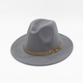 Detail of grey wool fedora hat featuring a brown leather band and golden buckle - Gray
