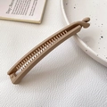 Matte light brown banana hair clip with secure locking mechanism on a stylish background - Khaki