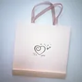 Pink gift bag with satin handles and heart logo for silk sleep set packaging - Tote Bag