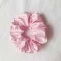 Pink satin scrunchie made of premium silk-like fabric with elegant glossy texture - Light Pink