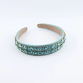 Elegant Baroque headband with double-row blue crystals on a golden frame over white background - Light Blue