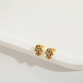 Detailed close-up of golden Hamsa stud earrings with colorful zircon micro-inlay stones - Hamsa Hand / Gold/Multicolor Zirconia