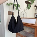 Black large hobo shoulder bag with textured pleats in a casual summer canvas style - Black