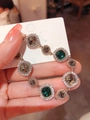 Elegant rose gold bracelet with square emerald and round champagne crystals on jewelry card - Green-Gray