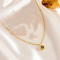 Detail of Roman numeral gold necklace with black gemstone pendant on silk - Black Rhinestone Roman Necklace