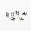Detailed macro view of H-shaped metal beads with vacuum plating and smooth silver finish - Letter H / Silver Gray