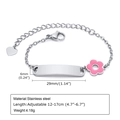 Macro detail of stainless steel bar bracelet with pink flower and adjustable heart charm - Style 21 Kids (Silver/Pink Flower/ID Plate)