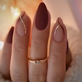 Long almond press-on nails in burgundy and nude with gold glitter lines and a gold ring - Deep Agate Red Nude Pink Matte Style (AW245)