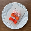 Three-piece ribbon bow hair clips in pink orange and red on a display card - Orange Series