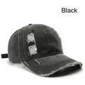 Distressed black vintage baseball cap with washed denim holes and ripped brim detail - Black