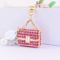Pink rhinestone handbag keychain with white rose and pearl charms in gold finish - Individual Packaging / Pink