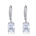 Macro detail of silver lever-back earrings with cushion-cut cubic zirconia and fine claw setting - White