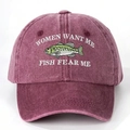 Close-up of white embroidery on a wine red washed cotton baseball cap with fish pattern - Burgundy