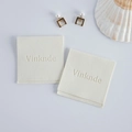 Two beige velvet jewelry pouches with flap closure and stamped logo for storage - Off White