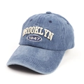 Detailed close-up of Brooklyn 1947 3D embroidery on washed denim baseball cap - Adjustable / Navy Blue