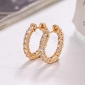 Elegant gold hoop earrings featuring micro-pave white cubic zirconia on a minimalist design - Gold