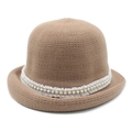 Close-up of knit cloche hat with white lace trim and elegant pearl embellishments - M (56-58cm) / Brown