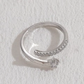 Minimalist silver-tone open star ring with cubic zirconia accents in a polished finish - Single Row Zirconia Star / Platinum Color