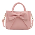 Chic pink bucket bag featuring a large bow decoration with top handle and shoulder strap - Pink